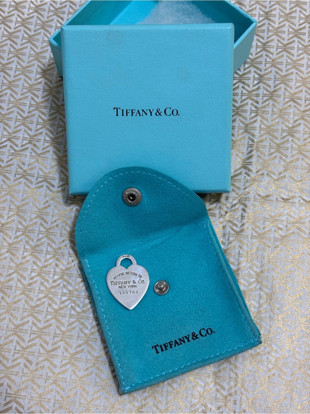 Tiffany & Co. Please Return To Heart Tag 
with Original Tiffany pouch and box.